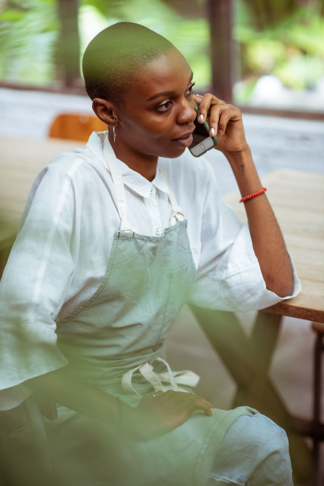 A business owner taking a call in her shop